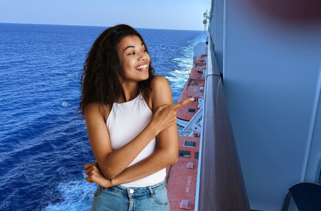 woman pointing at cruise ship